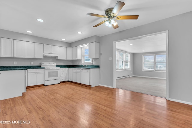 kitchen featuring white appliances, white cabinetry, dark countertops, light wood-type flooring, and baseboard heating