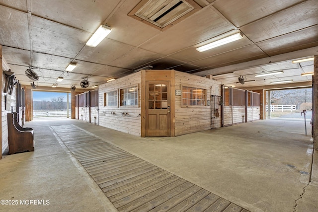 view of horse barn featuring visible vents