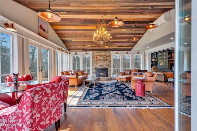 living room featuring french doors, wooden ceiling, lofted ceiling, and wood finished floors