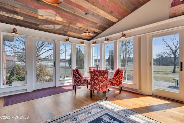 sunroom featuring wooden ceiling and vaulted ceiling