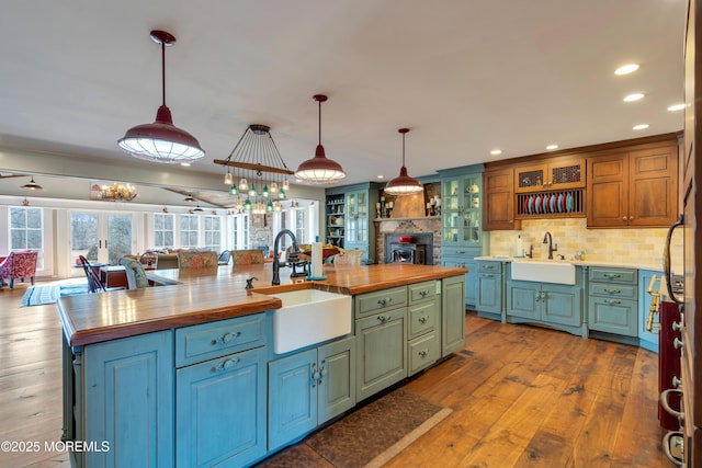 kitchen with a center island with sink, open floor plan, and a sink