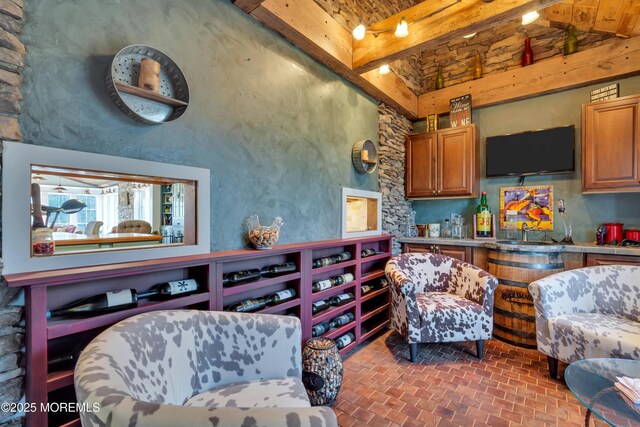 living room with brick floor and a towering ceiling