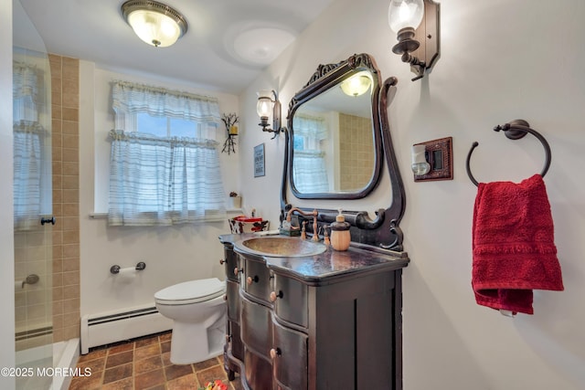 bathroom with toilet, baseboards, baseboard heating, walk in shower, and vanity