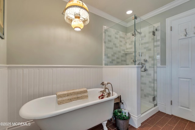 full bathroom with a shower stall, wainscoting, crown molding, a freestanding bath, and wood tiled floor