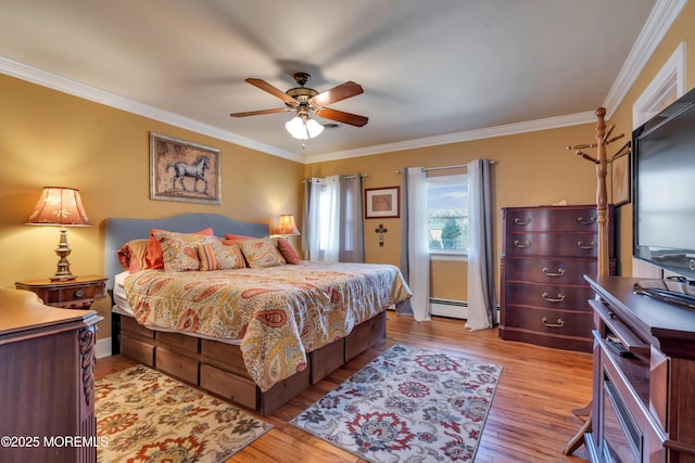 bedroom with a ceiling fan, wood finished floors, baseboard heating, and ornamental molding