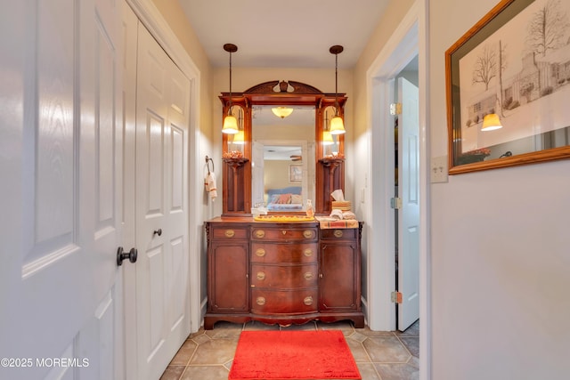 bathroom with tile patterned flooring and vanity