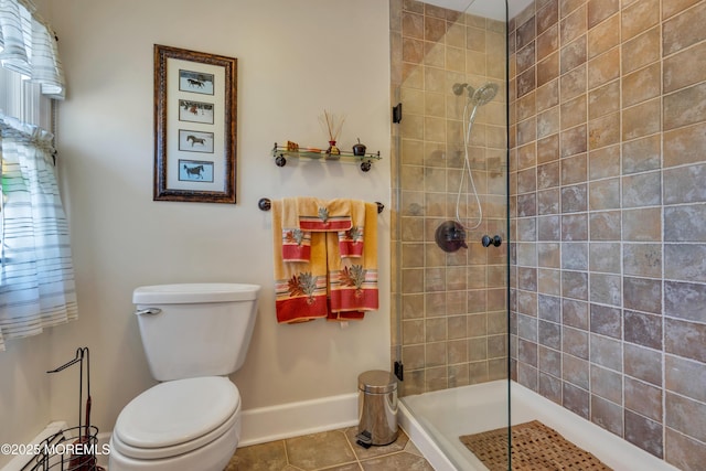 bathroom featuring baseboards, a tile shower, tile patterned floors, toilet, and baseboard heating