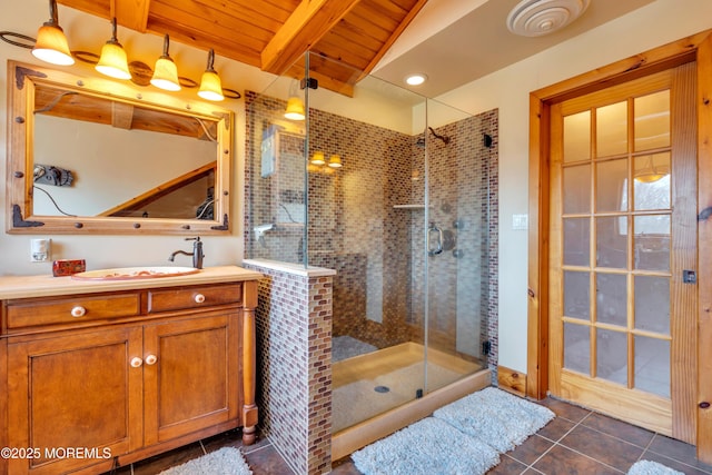 full bathroom with beamed ceiling, a stall shower, wooden ceiling, tile patterned floors, and vanity