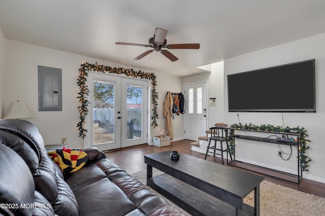 living area with electric panel, french doors, a ceiling fan, and wood finished floors