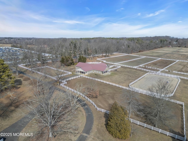 drone / aerial view with a rural view and a wooded view