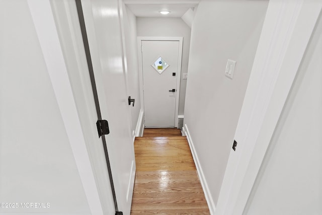 entryway featuring light wood-type flooring and baseboards