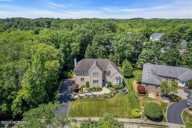 bird's eye view featuring a forest view