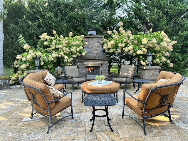 view of patio / terrace featuring an outdoor living space with a fireplace