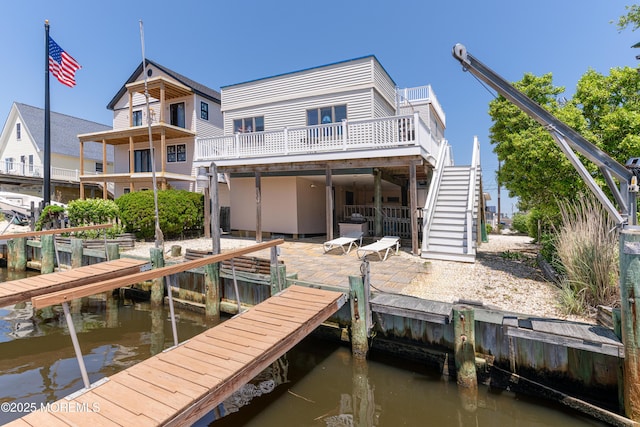 35 W Mohawk Dr, Little Egg Harbor, NJ 08087 - dock area with stairway, a deck with water view, and a patio area