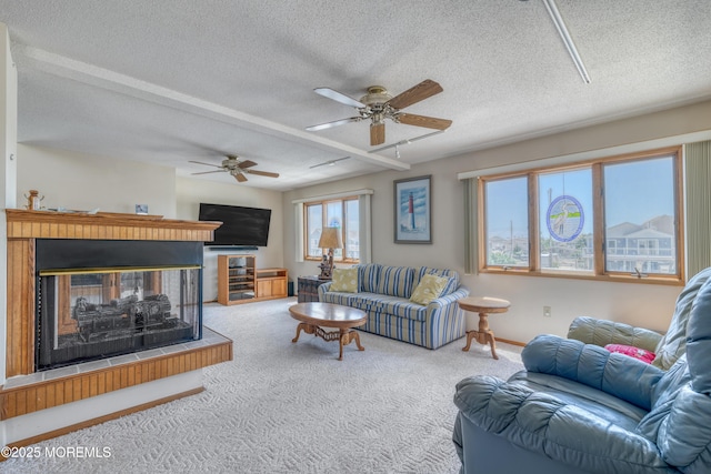 35 W Mohawk Dr, Little Egg Harbor, NJ 08087 - living area with carpet floors, ceiling fan, a multi sided fireplace, a textured ceiling, and baseboards
