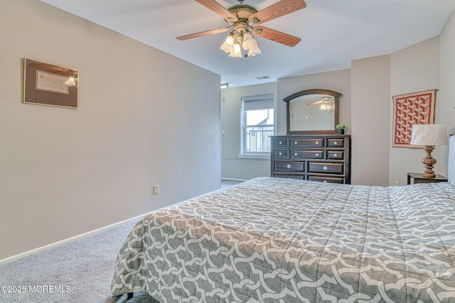 carpeted bedroom featuring visible vents, baseboards, and ceiling fan