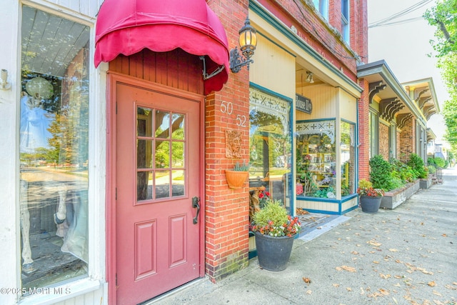 entrance to property with brick siding