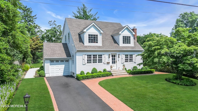 cape cod-style house featuring driveway, a front lawn, roof with shingles, a garage, and a chimney