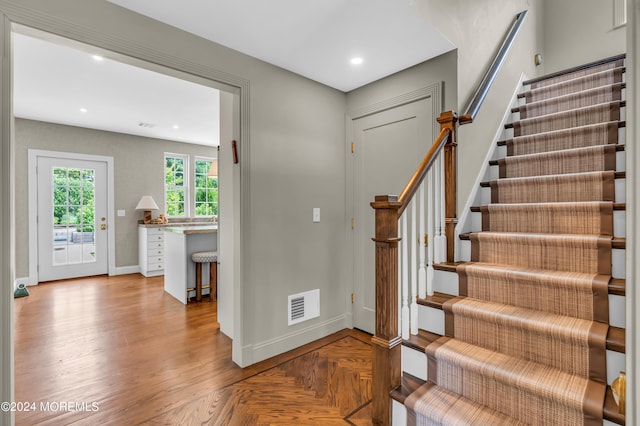 foyer with stairway, recessed lighting, baseboards, and visible vents