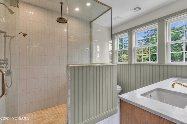 full bathroom with a sink, visible vents, toilet, and walk in shower