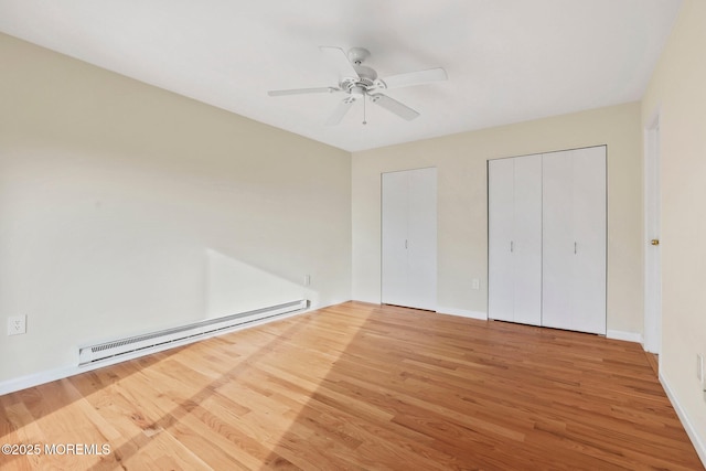 5 Island View Way Unit 3, Sea Bright, NJ 07760 - unfurnished bedroom with baseboard heating, wood finished floors, and baseboards
