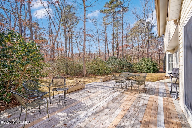 deck with outdoor dining area