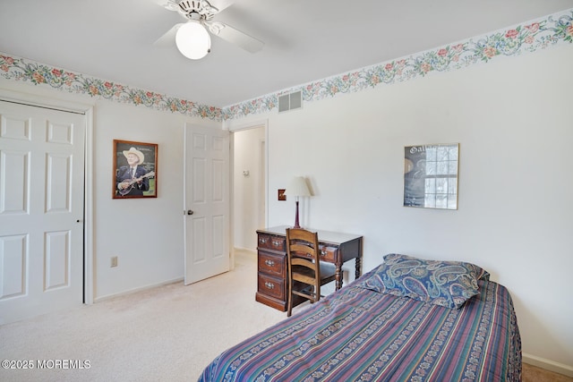 carpeted bedroom with a ceiling fan, visible vents, and baseboards