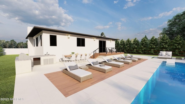 back of house featuring a deck, stucco siding, and an outdoor hangout area