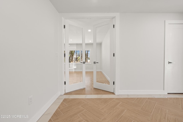 hallway featuring recessed lighting, baseboards, and french doors