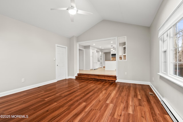 unfurnished living room with visible vents, a ceiling fan, a baseboard heating unit, wood finished floors, and baseboards