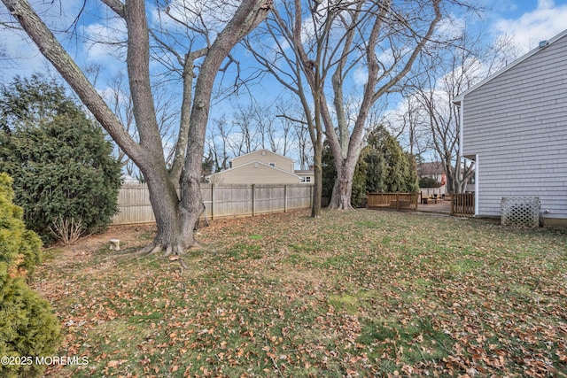 view of yard with a hot tub and fence