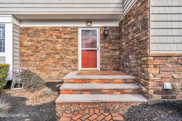 entrance to property with stone siding