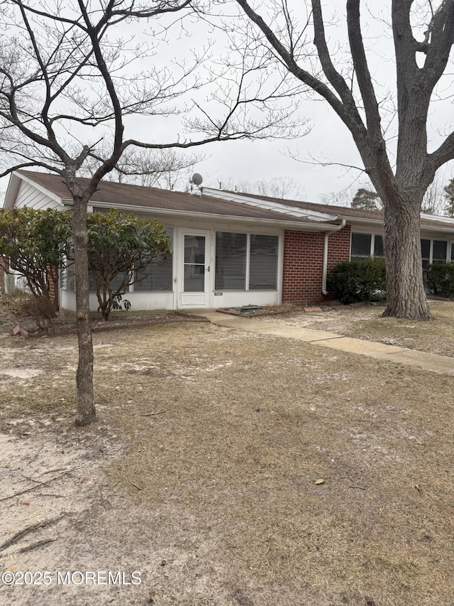 view of front of home with brick siding