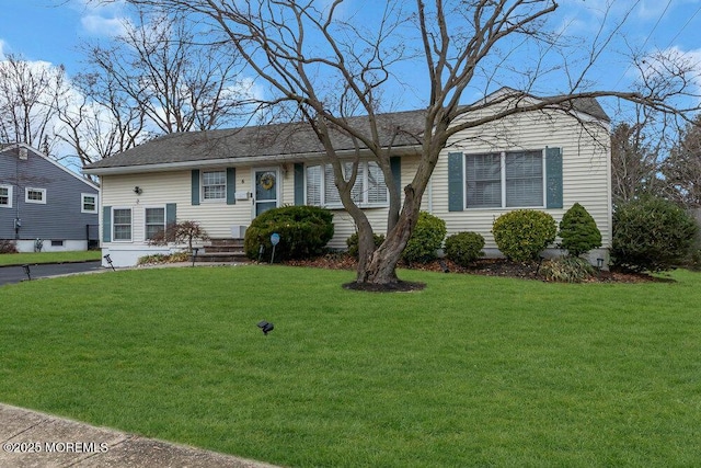 ranch-style home featuring a front yard