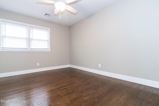 empty room featuring visible vents, baseboards, and ceiling fan