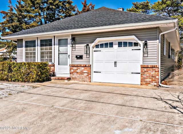 1820 Mount Idenburg Ln, Toms River, NJ 08753 - view of front facade with brick siding, a shingled roof, concrete driveway, and a garage