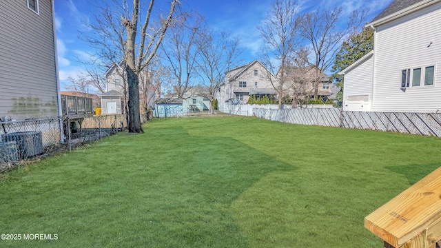 view of yard with a residential view and fence