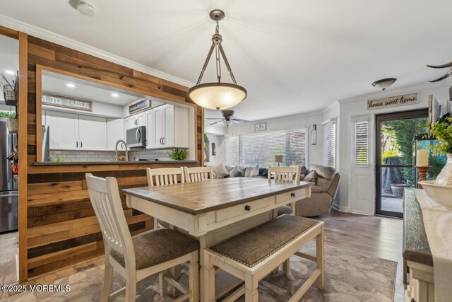 144 Brandywine Ct Unit 332, Brick, NJ 08724 - dining room featuring wood finished floors, a ceiling fan, and ornamental molding