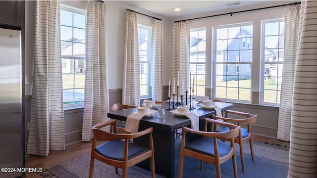 dining room with baseboards and wood finished floors