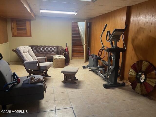 workout room featuring wooden walls