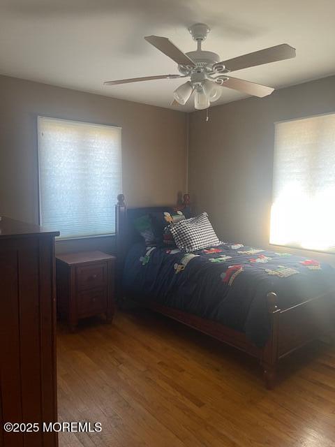 unfurnished bedroom featuring a ceiling fan and wood finished floors