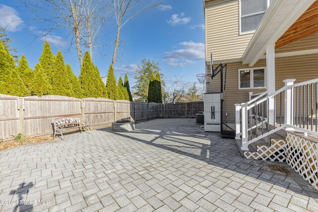 view of patio / terrace with central AC unit and a fenced backyard
