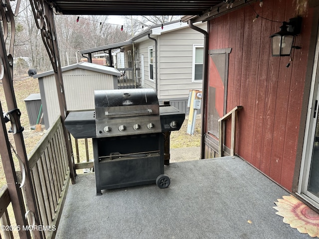 view of patio / terrace featuring grilling area and an outdoor structure