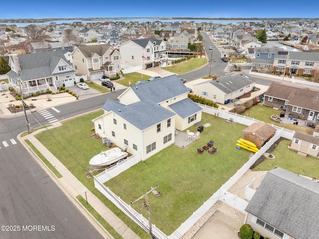 birds eye view of property with a residential view