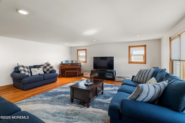 living room with recessed lighting and wood finished floors