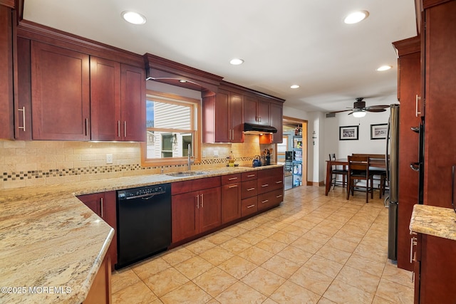 kitchen with a ceiling fan, a sink, black appliances, tasteful backsplash, and reddish brown cabinets