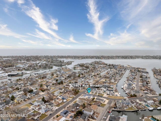 aerial view with a residential view and a water view