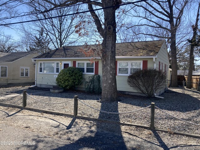 view of front of property featuring fence