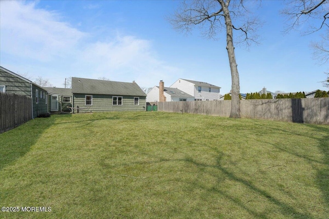 view of yard featuring a fenced backyard