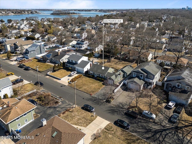 bird's eye view featuring a residential view and a water view